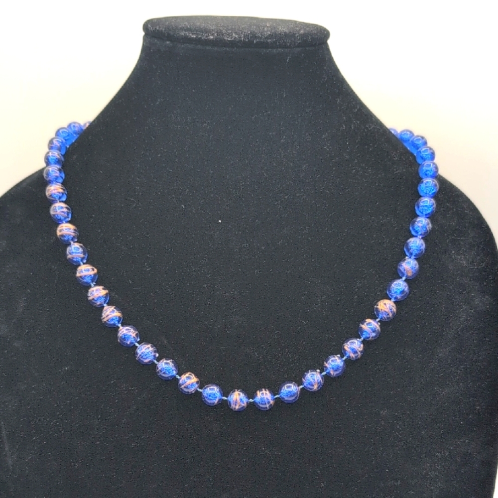 Elegant Blue Beaded Necklace With Gold Toned Paint Splash